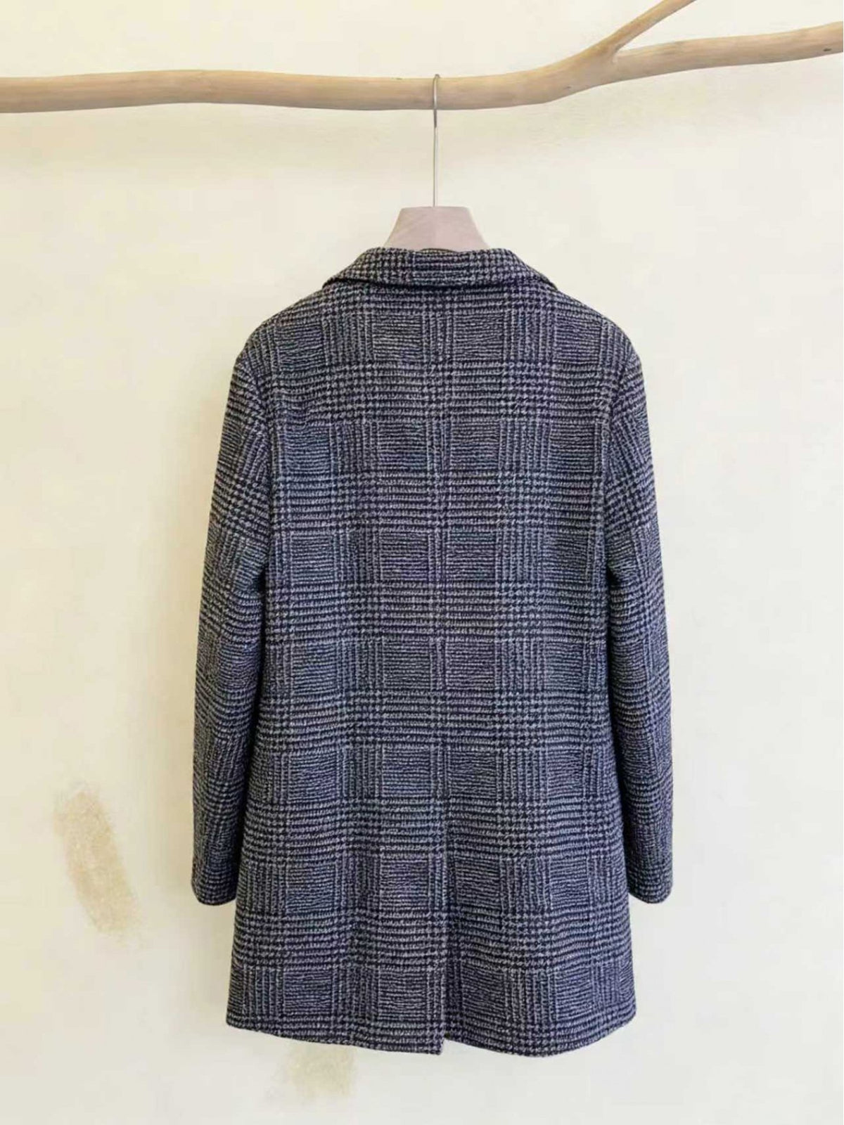 Side view of the men's houndstooth check coat showing the fit