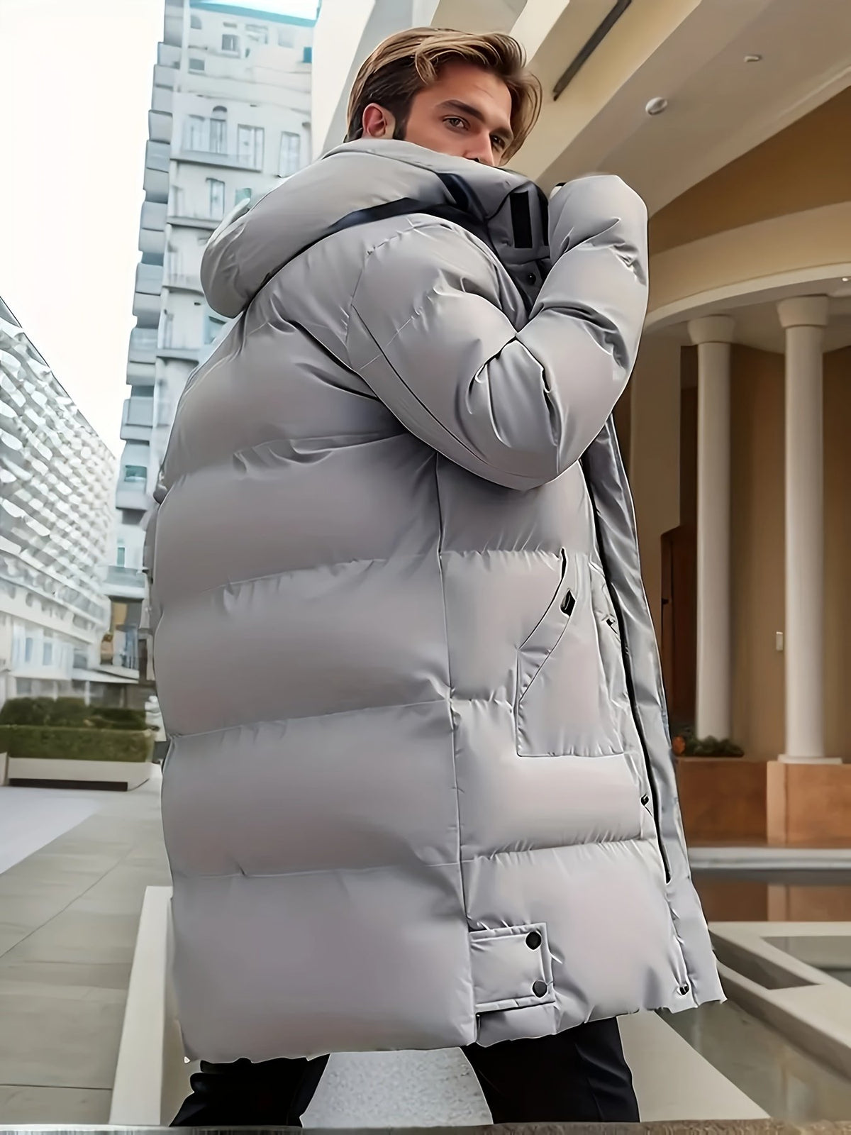 Close-up of the men's hooded zip winter jacket fabric and stitching