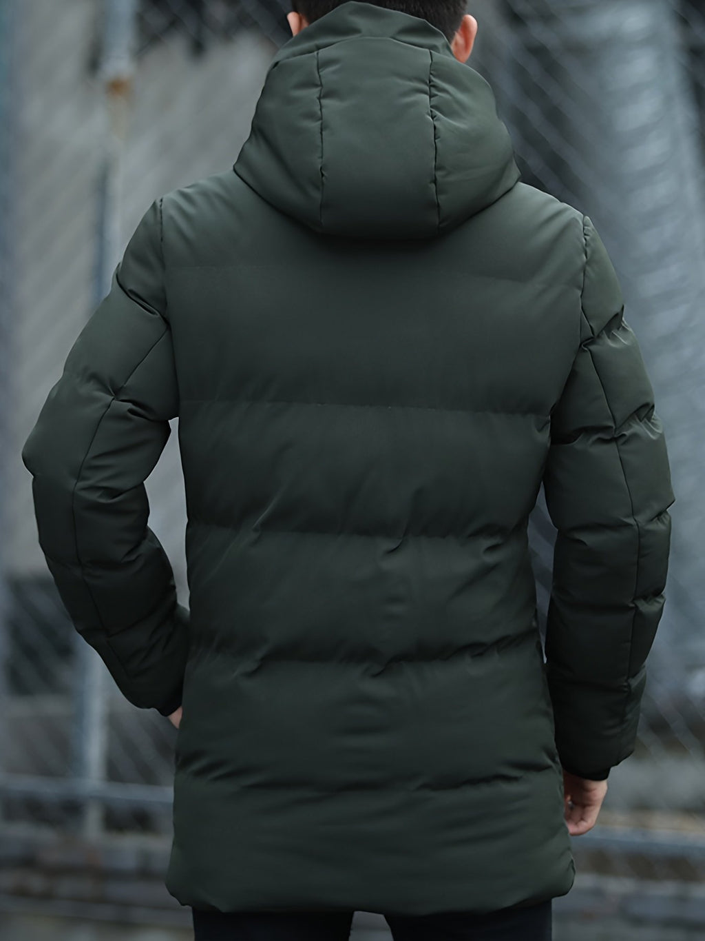 Close-up of the men's mid-length padded parka fabric and stitching
