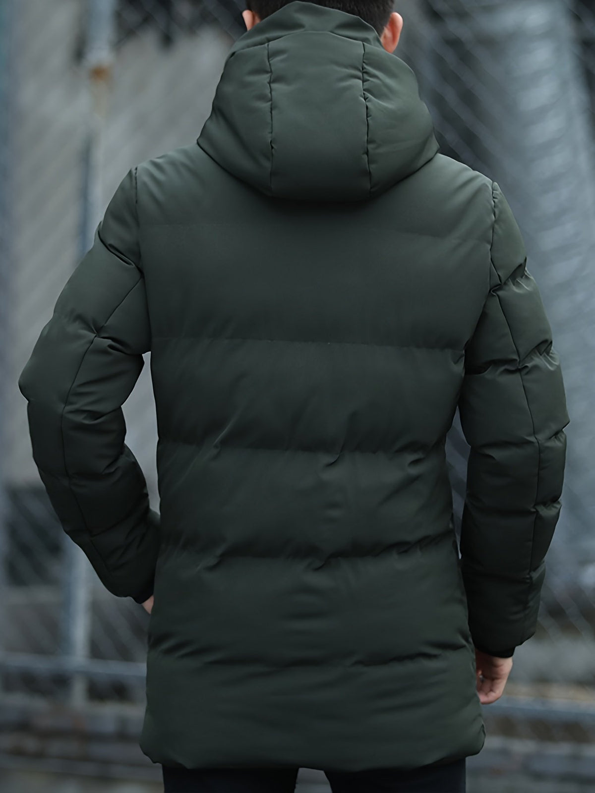Close-up of the men's mid-length padded parka fabric and stitching