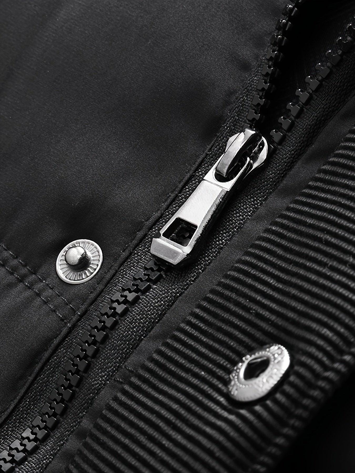 Close-up of the men's fleece-lined hooded coat fabric and stitching