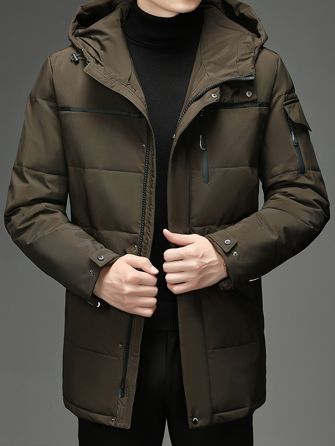 Close-up of the men's padded hooded parka fabric and stitching