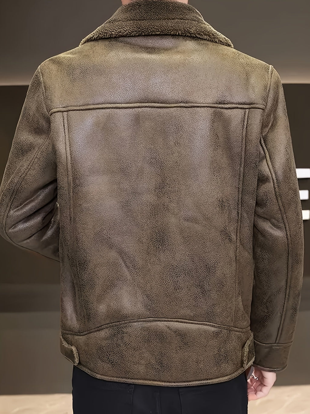 Close-up of the men's faux leather jacket fabric and stitching