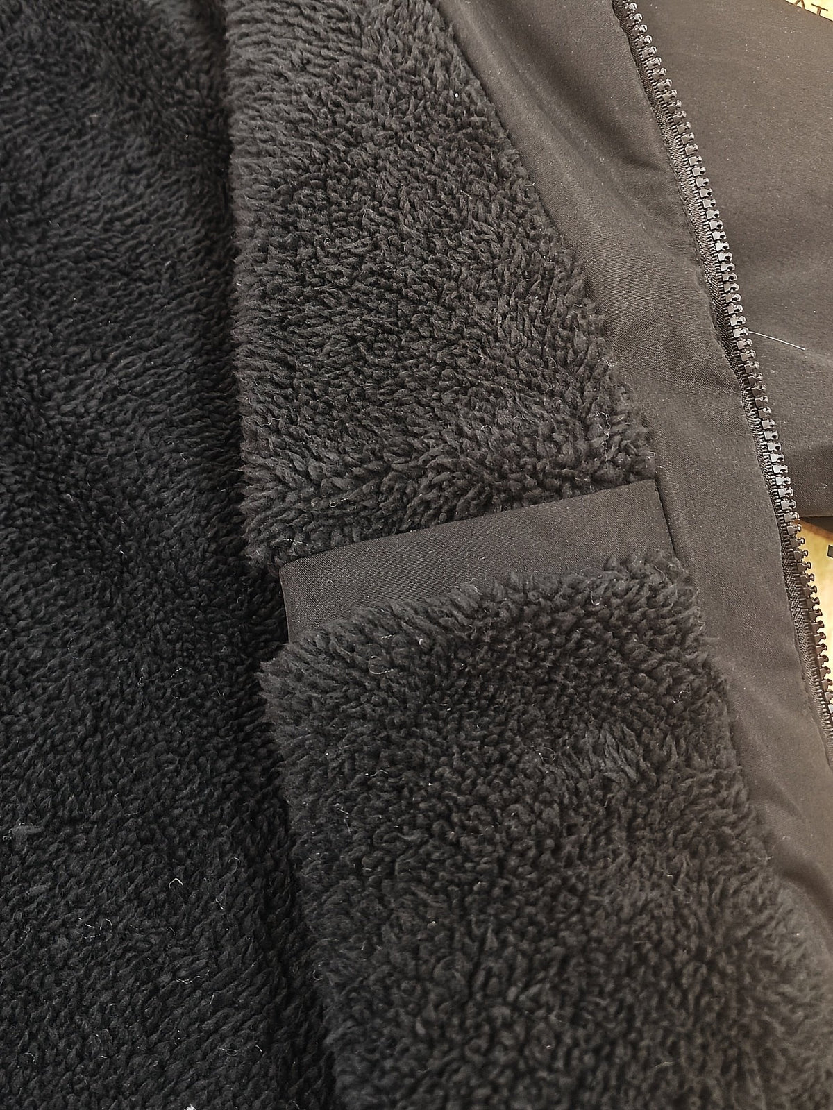 Collar and fastening detail of the men's knee-length padded coat