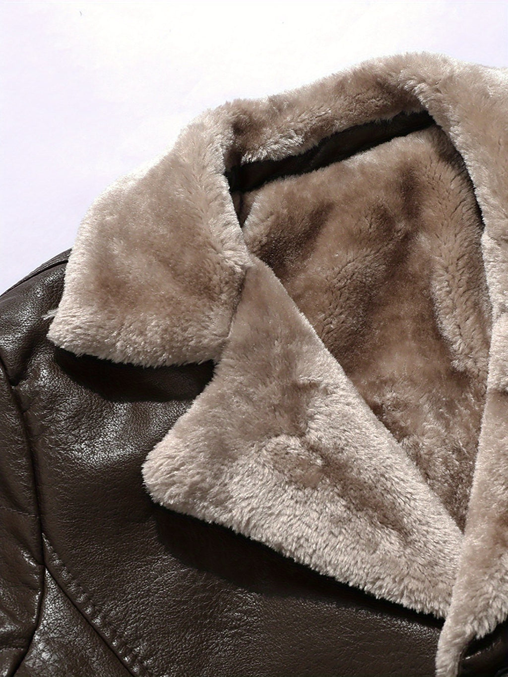 Collar and fastening detail of the men's faux leather coat
