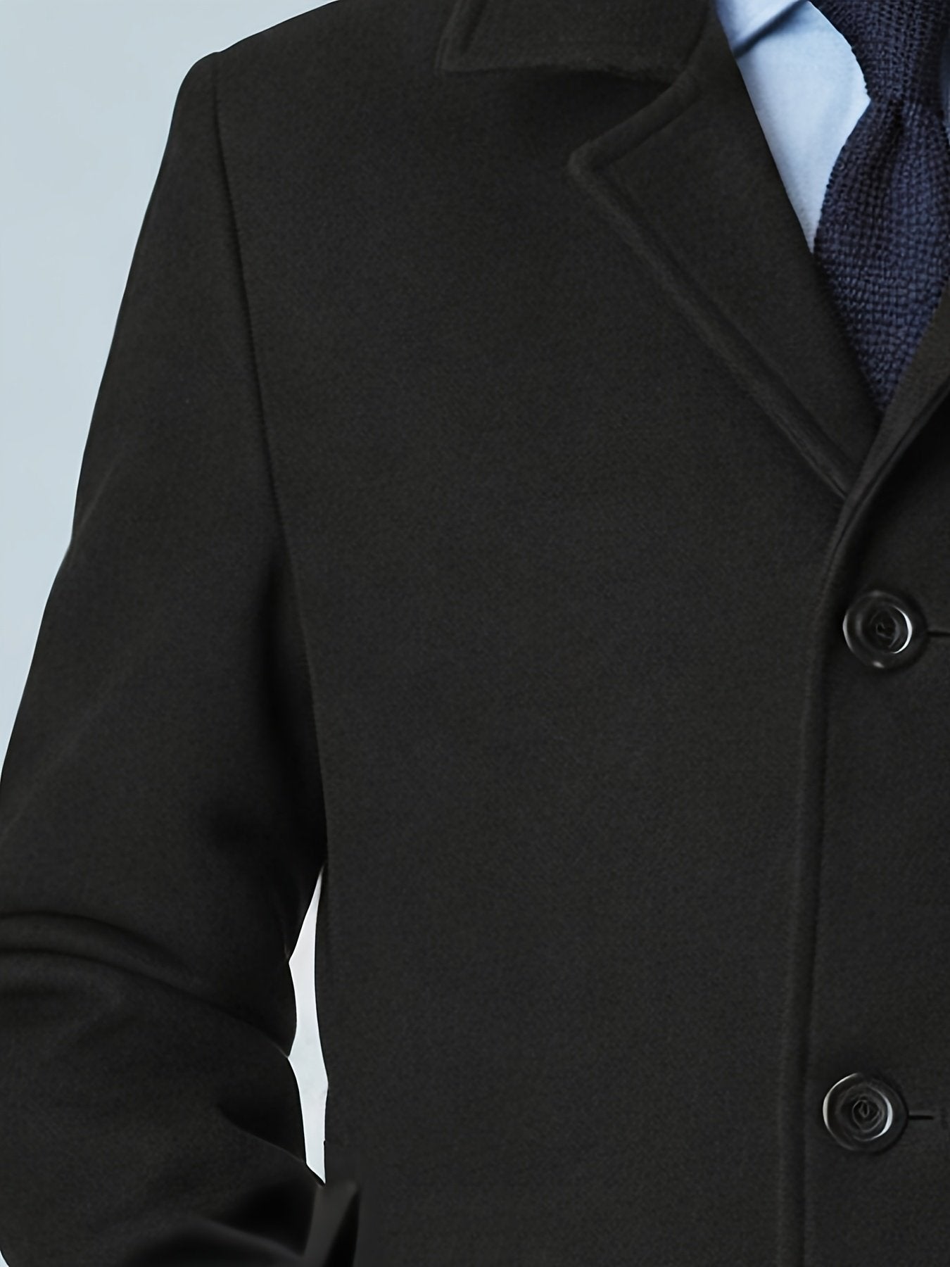 Back view of the men's black trench coat
