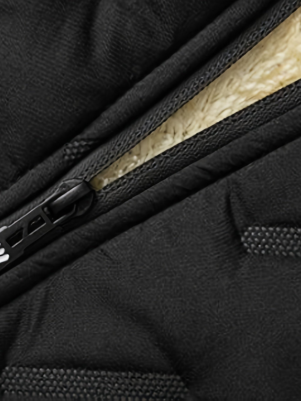 Close-up of the men's thermal insulated jacket fabric and stitching