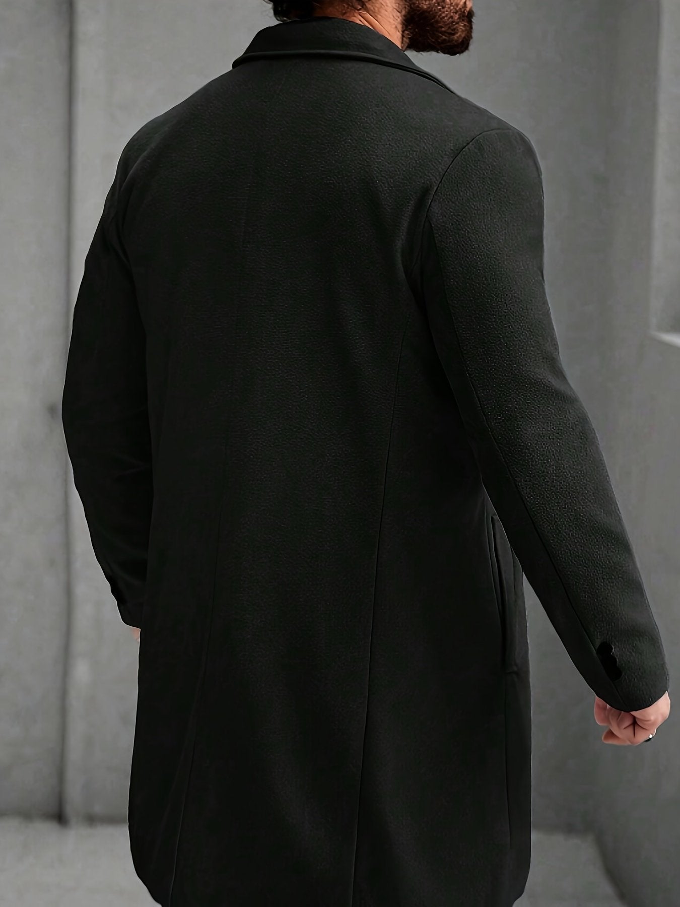 Close-up of the men's long warm trench coat fabric and stitching
