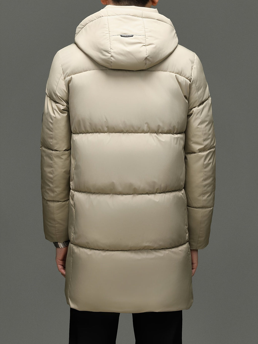 Close-up of the men's long padded puffer jacket fabric and stitching