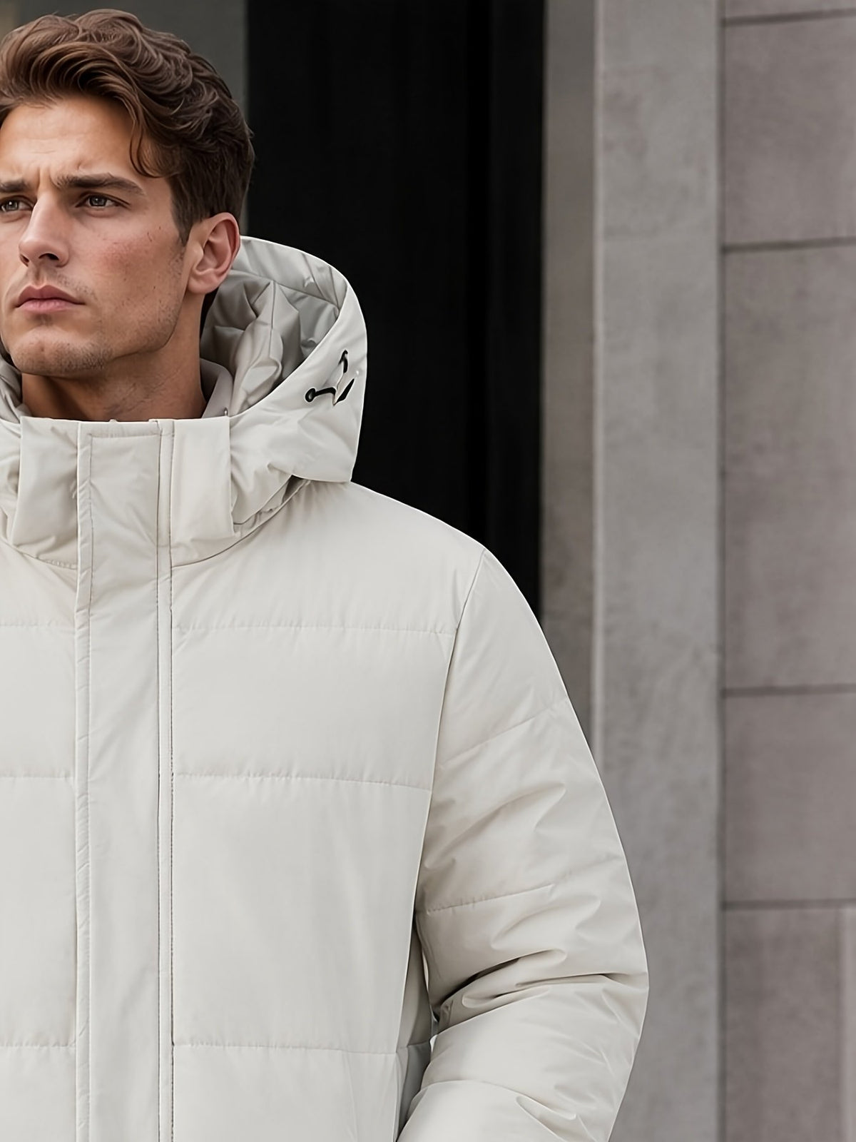 Men's long duck down jacket styled with jeans for cold weather