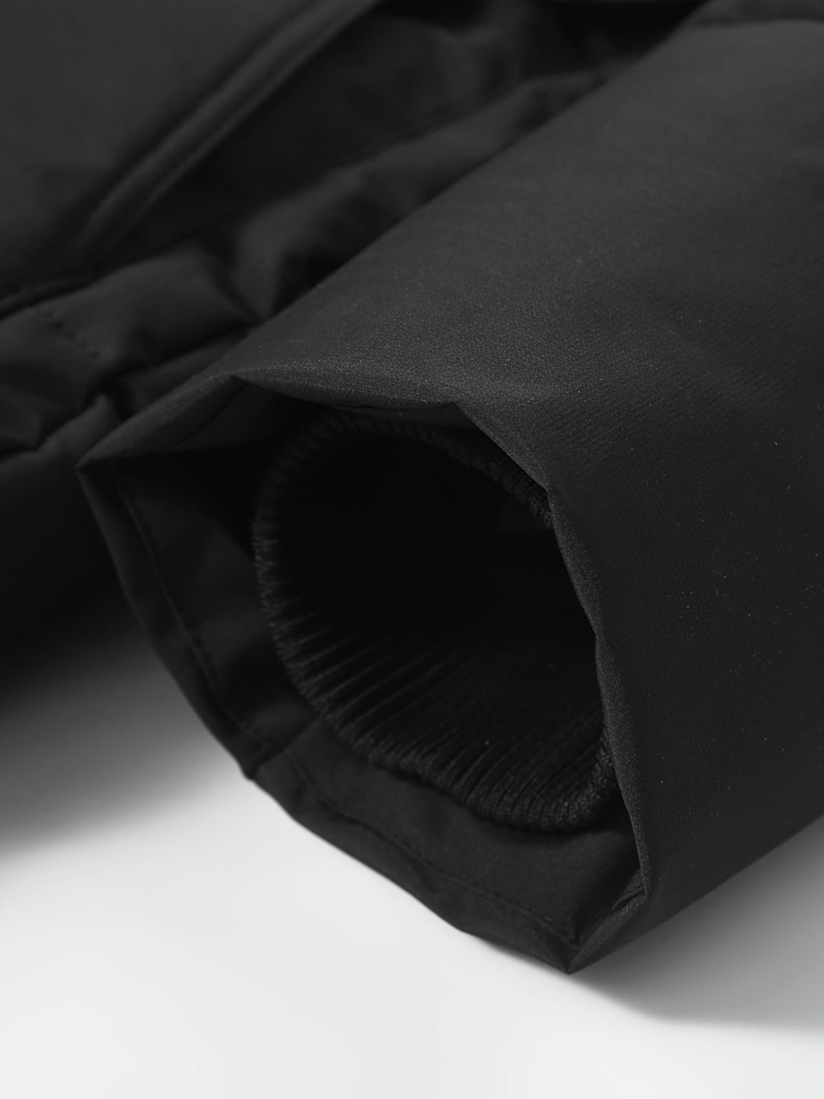 Men's long glossy padded jacket styled with jeans for cold weather
