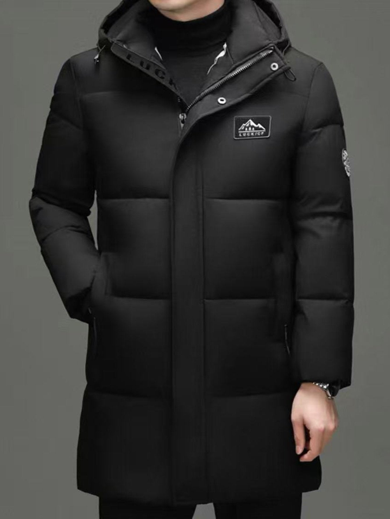 Pocket detail on the men's mid-length hooded padded coat