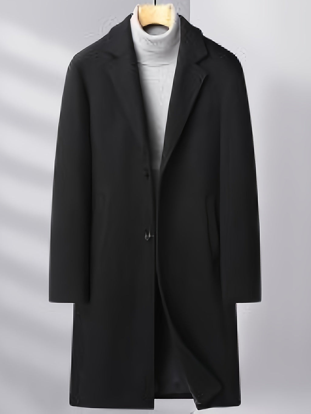 Pocket detail on the men's knee-length wool overcoat