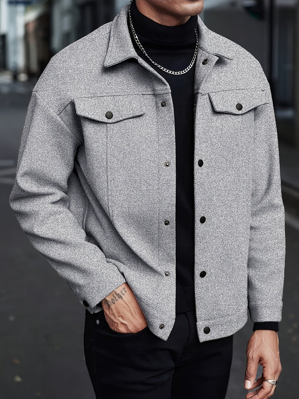 Pocket detail on the men's short lapel jacket
