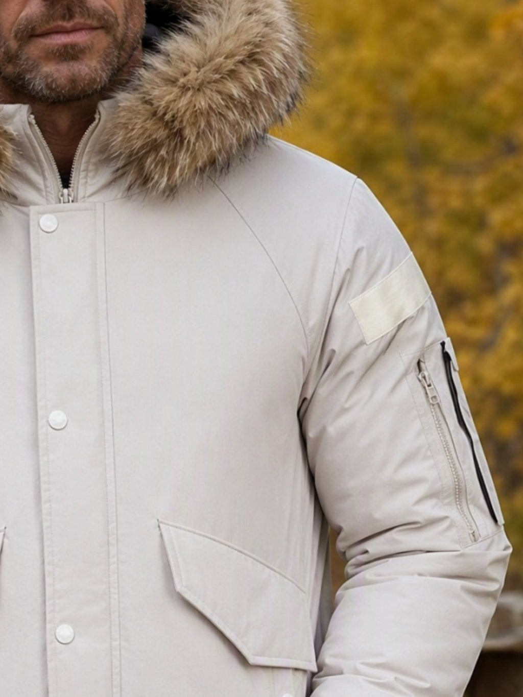 Men's mid-length duck down coat styled with jeans for cold weather