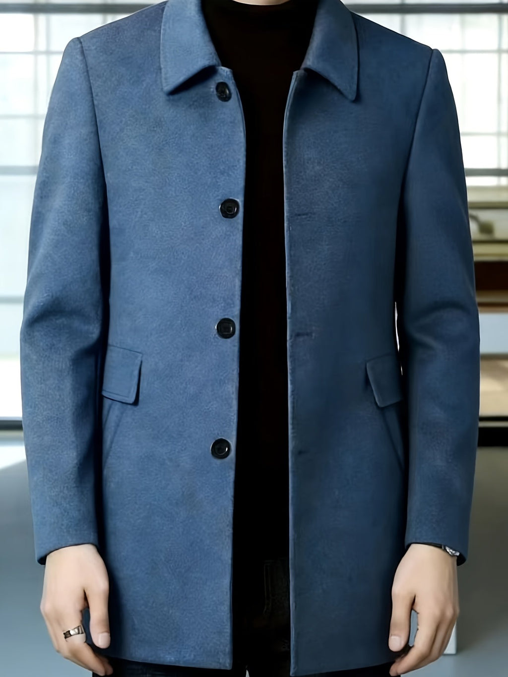 Men's single-breasted overcoat styled with jeans for cold weather